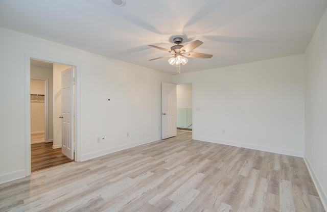 spare room with light hardwood / wood-style flooring and ceiling fan