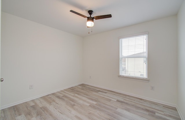 empty room with ceiling fan and light wood-type flooring