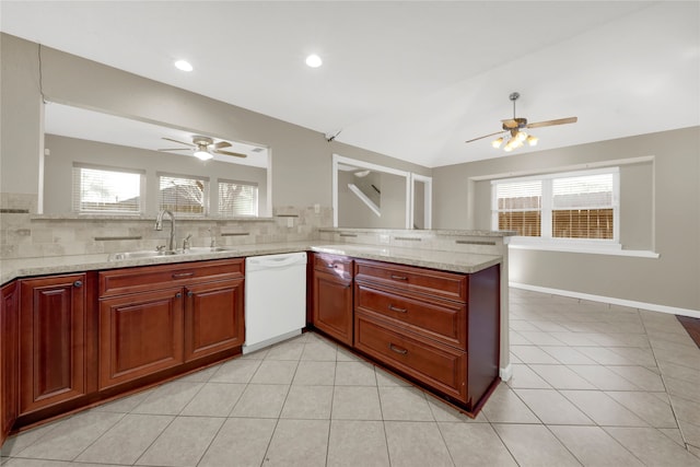 kitchen with sink, light stone counters, kitchen peninsula, white dishwasher, and decorative backsplash