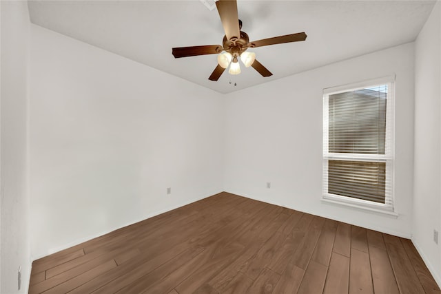 spare room featuring ceiling fan and wood-type flooring