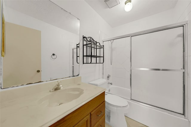 full bathroom with vanity, toilet, enclosed tub / shower combo, and a textured ceiling