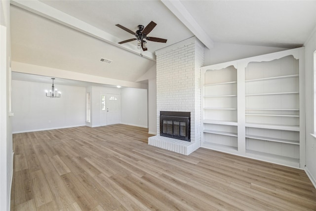 unfurnished living room with light hardwood / wood-style floors, lofted ceiling with beams, ceiling fan with notable chandelier, and a brick fireplace