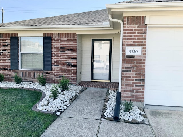 doorway to property featuring a garage