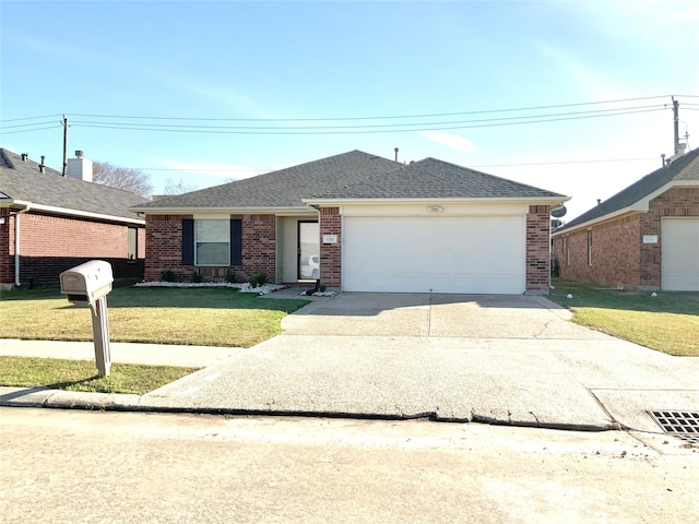 ranch-style house featuring a front yard and a garage