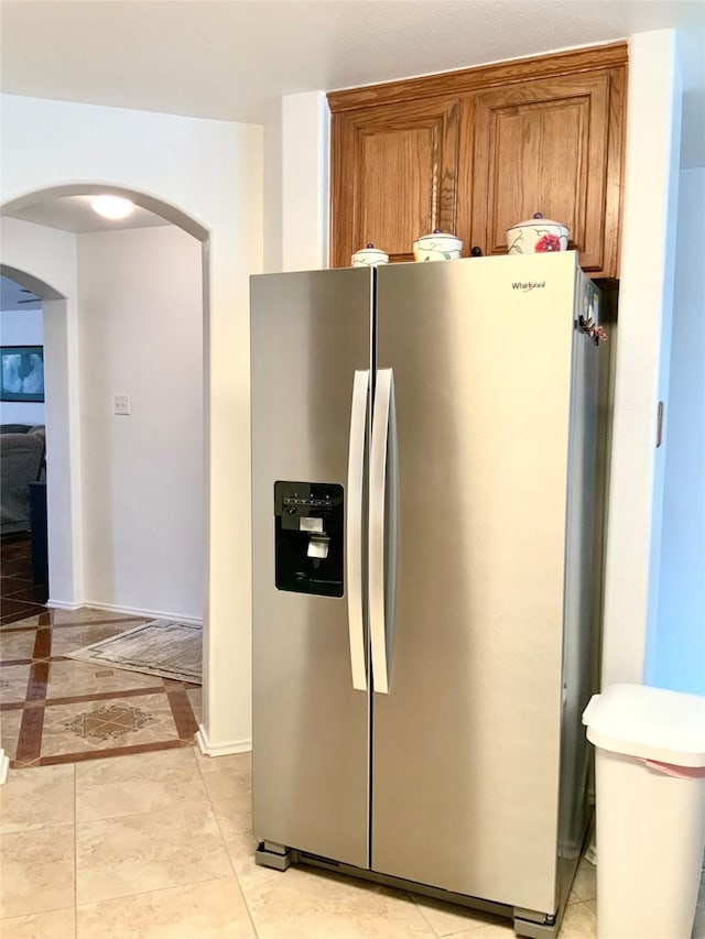 kitchen featuring stainless steel fridge with ice dispenser