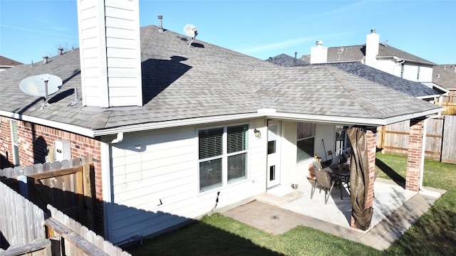 back of property with a patio area