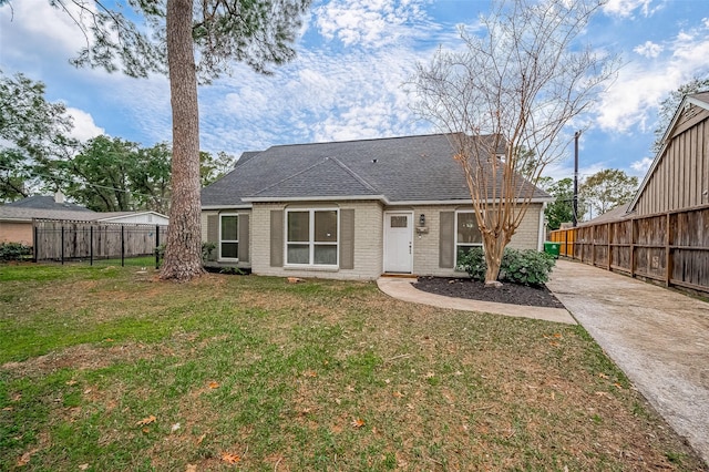 rear view of house with a yard