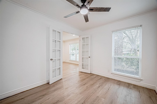 spare room featuring ceiling fan, french doors, light hardwood / wood-style floors, and ornamental molding