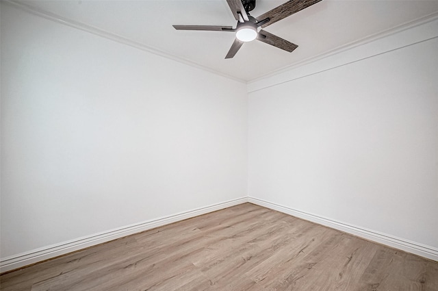 empty room featuring ceiling fan, light hardwood / wood-style floors, and crown molding