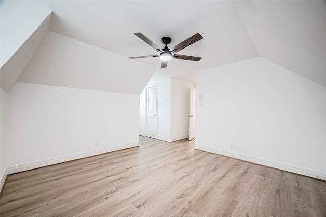 bonus room featuring light wood-type flooring, ceiling fan, and lofted ceiling