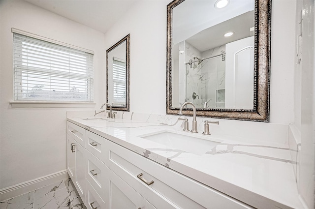 bathroom with a shower and vanity