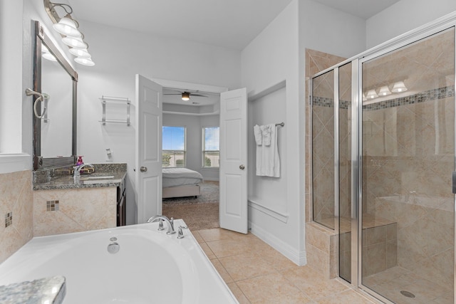 bathroom featuring ceiling fan, vanity, tile patterned floors, and independent shower and bath