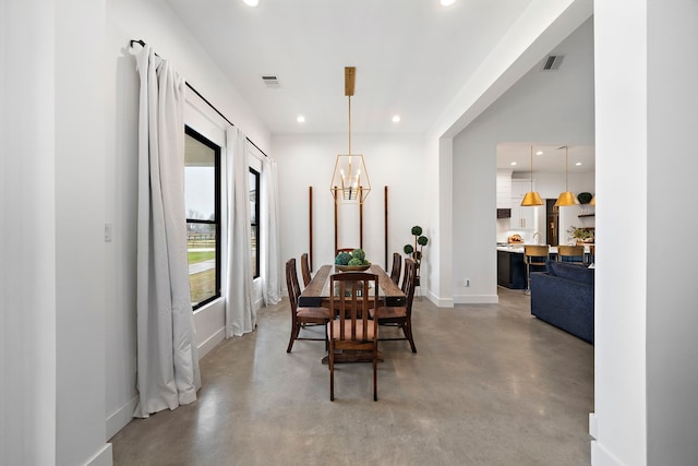 4103 Lea Ln, Fulshear, TX 77406 - dining area with concrete flooring, recessed lighting, and a chandelier