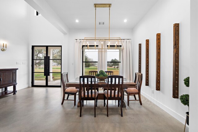 4103 Lea Ln, Fulshear, TX 77406 - dining area featuring concrete flooring, a chandelier, and recessed lighting