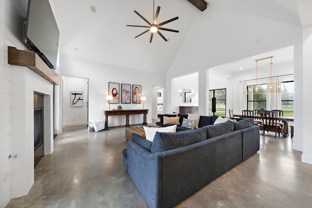 4103 Lea Ln, Fulshear, TX 77406 - living area featuring high vaulted ceiling, concrete floors, ceiling fan, beamed ceiling, and a fireplace