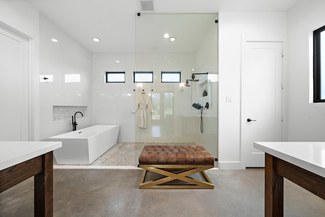 4103 Lea Ln, Fulshear, TX 77406 - full bath with walk in shower, a soaking tub, concrete floors, vanity, and recessed lighting