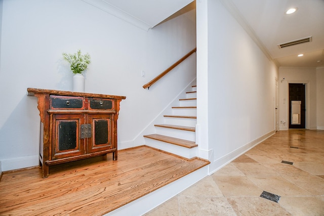 stairs featuring ornamental molding