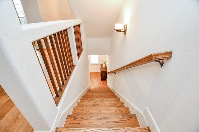 stairway featuring hardwood / wood-style flooring