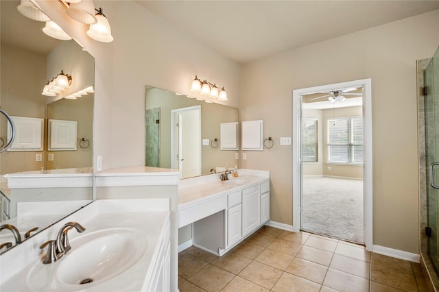 bathroom featuring ceiling fan, vanity, tile patterned floors, and a shower with shower door