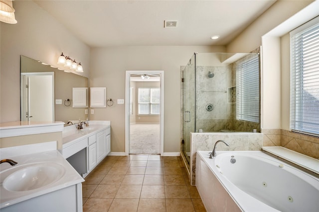 bathroom featuring vanity, tile patterned flooring, and plus walk in shower