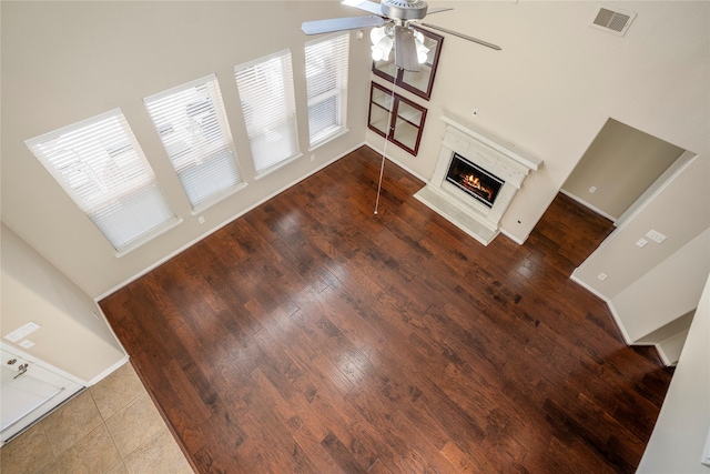 living room with hardwood / wood-style floors and ceiling fan