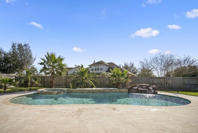 view of swimming pool featuring a patio, pool water feature, and an in ground hot tub