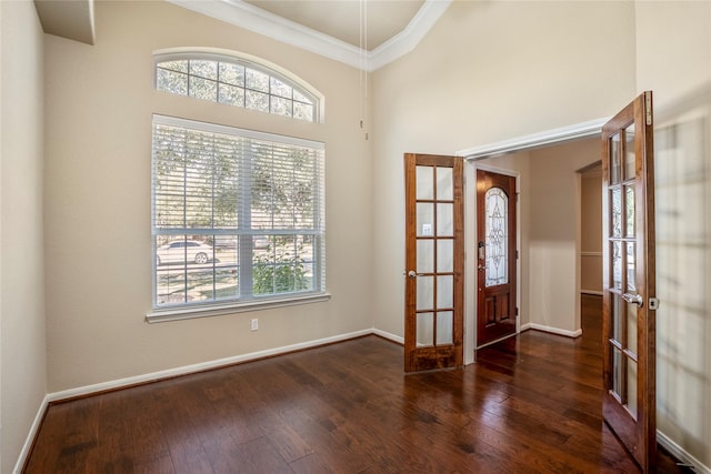 empty room with dark wood-type flooring, french doors, and a healthy amount of sunlight