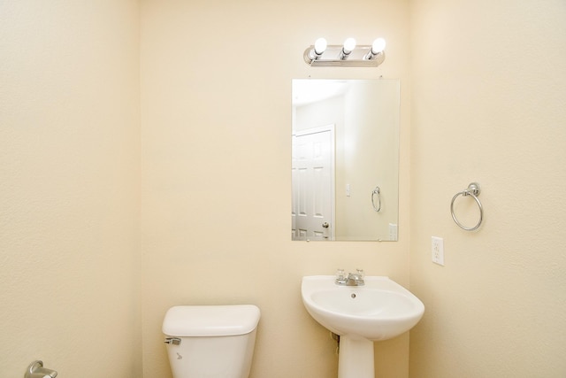 bathroom featuring sink and toilet