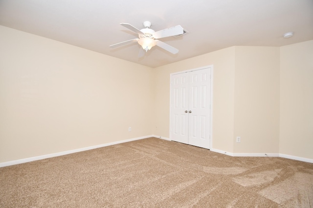 unfurnished room with ceiling fan and carpet floors