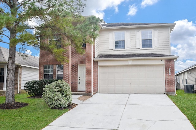 view of front property featuring cooling unit, a garage, and a front yard