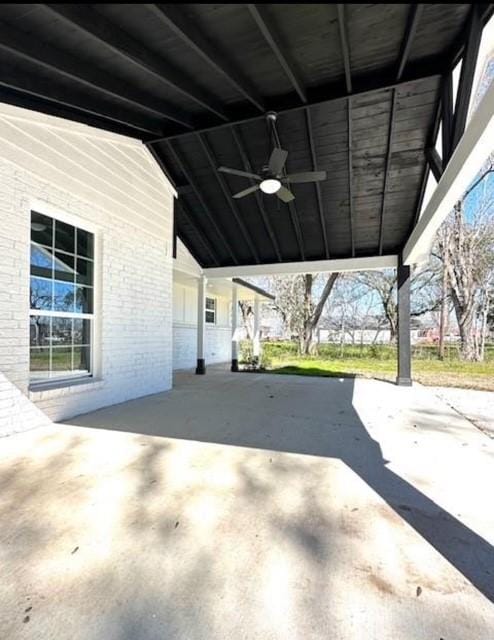 view of patio featuring a carport and ceiling fan