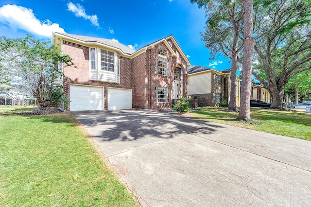 view of front of house featuring a garage and a front lawn