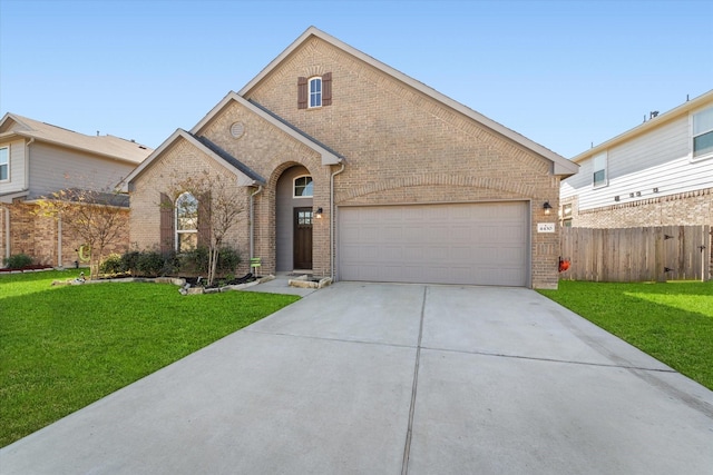 view of front of house with a front lawn and a garage