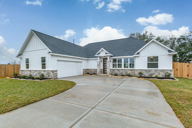 modern farmhouse style home with a garage and a front lawn