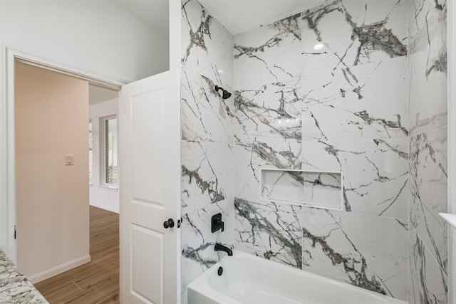 bathroom with bathing tub / shower combination