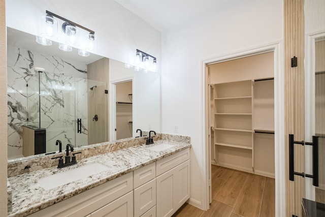 bathroom featuring vanity and walk in shower