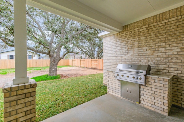 view of patio / terrace featuring an outdoor kitchen and grilling area