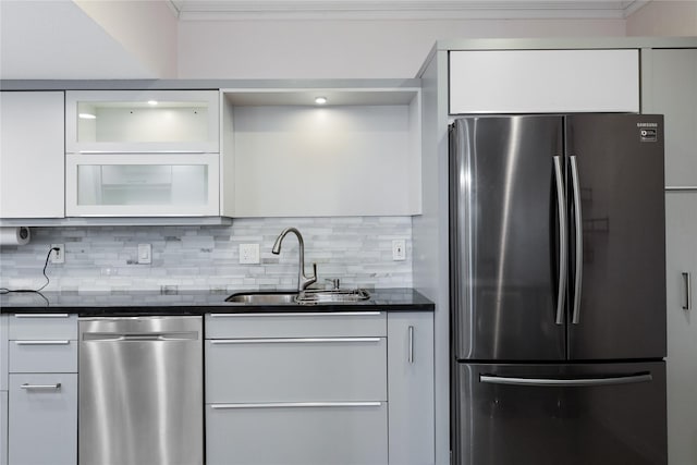 kitchen featuring sink, white cabinets, and appliances with stainless steel finishes