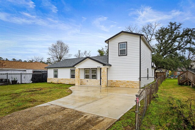 back of property featuring a yard and a patio