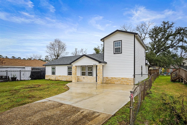 back of house with a patio and a lawn