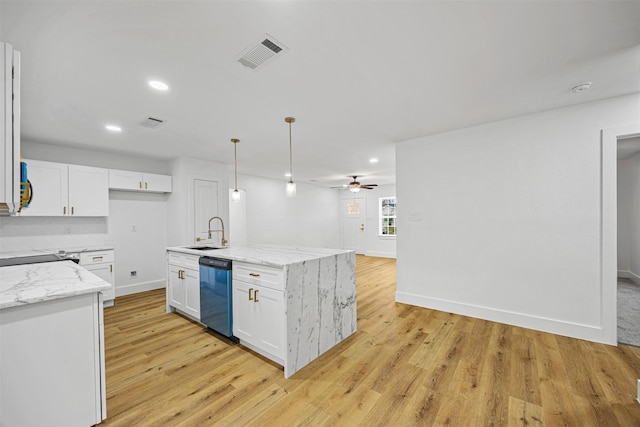 kitchen featuring white cabinetry, black dishwasher, pendant lighting, and a kitchen island with sink