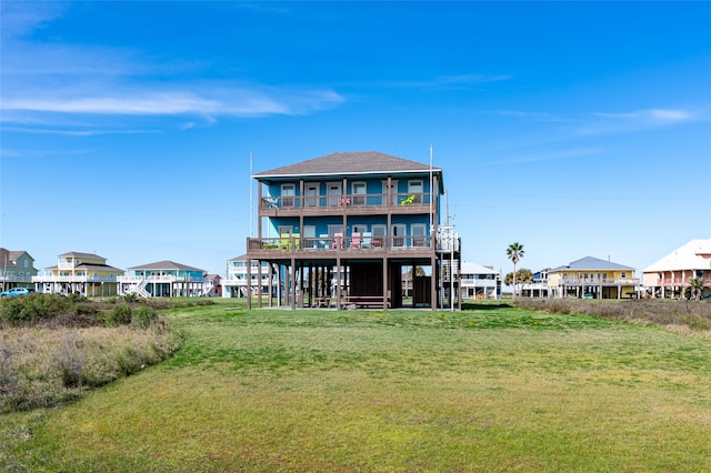 back of property featuring a lawn