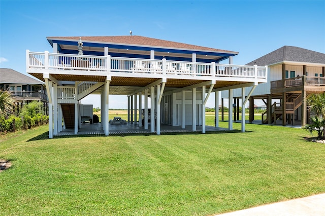 back of house featuring a yard and a deck