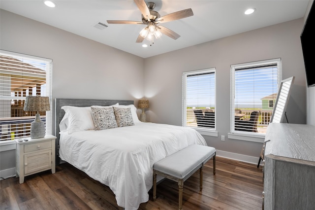 bedroom featuring ceiling fan and dark wood-type flooring