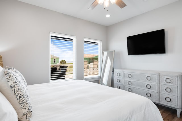 bedroom featuring ceiling fan and dark hardwood / wood-style flooring