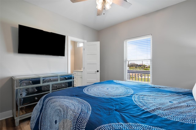 bedroom with ceiling fan and dark hardwood / wood-style flooring