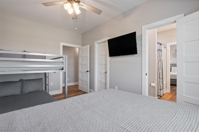 bedroom with wood-type flooring, ensuite bathroom, and ceiling fan