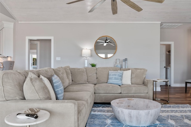 living room featuring dark hardwood / wood-style flooring and crown molding