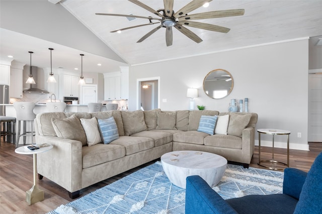 living room featuring ornamental molding, high vaulted ceiling, ceiling fan, and dark wood-type flooring