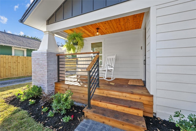 view of exterior entry featuring a porch